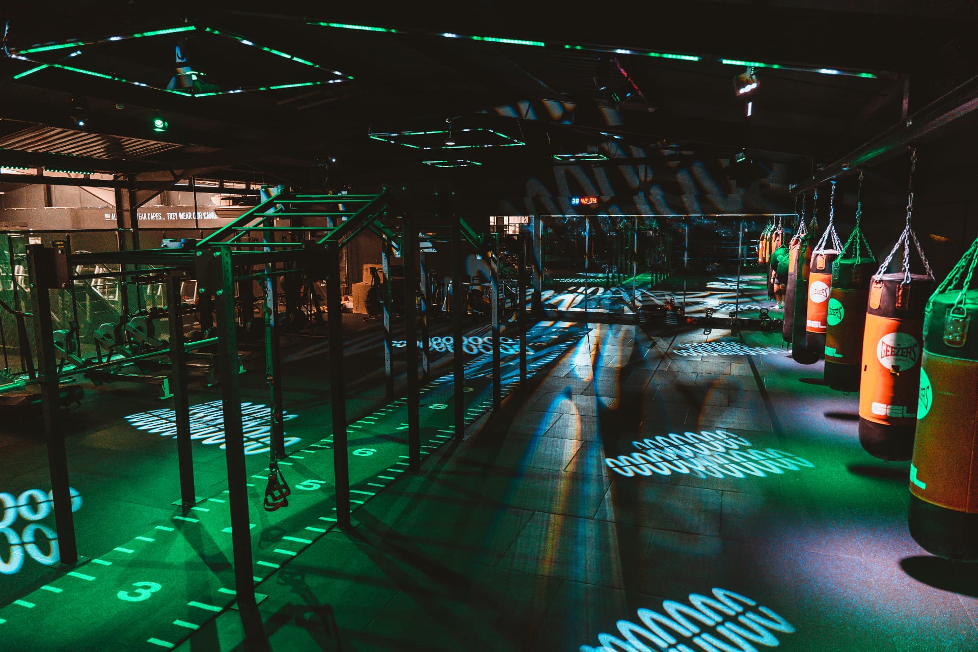 Functional rig, sled track and heavy bags lit up in the Heros studio